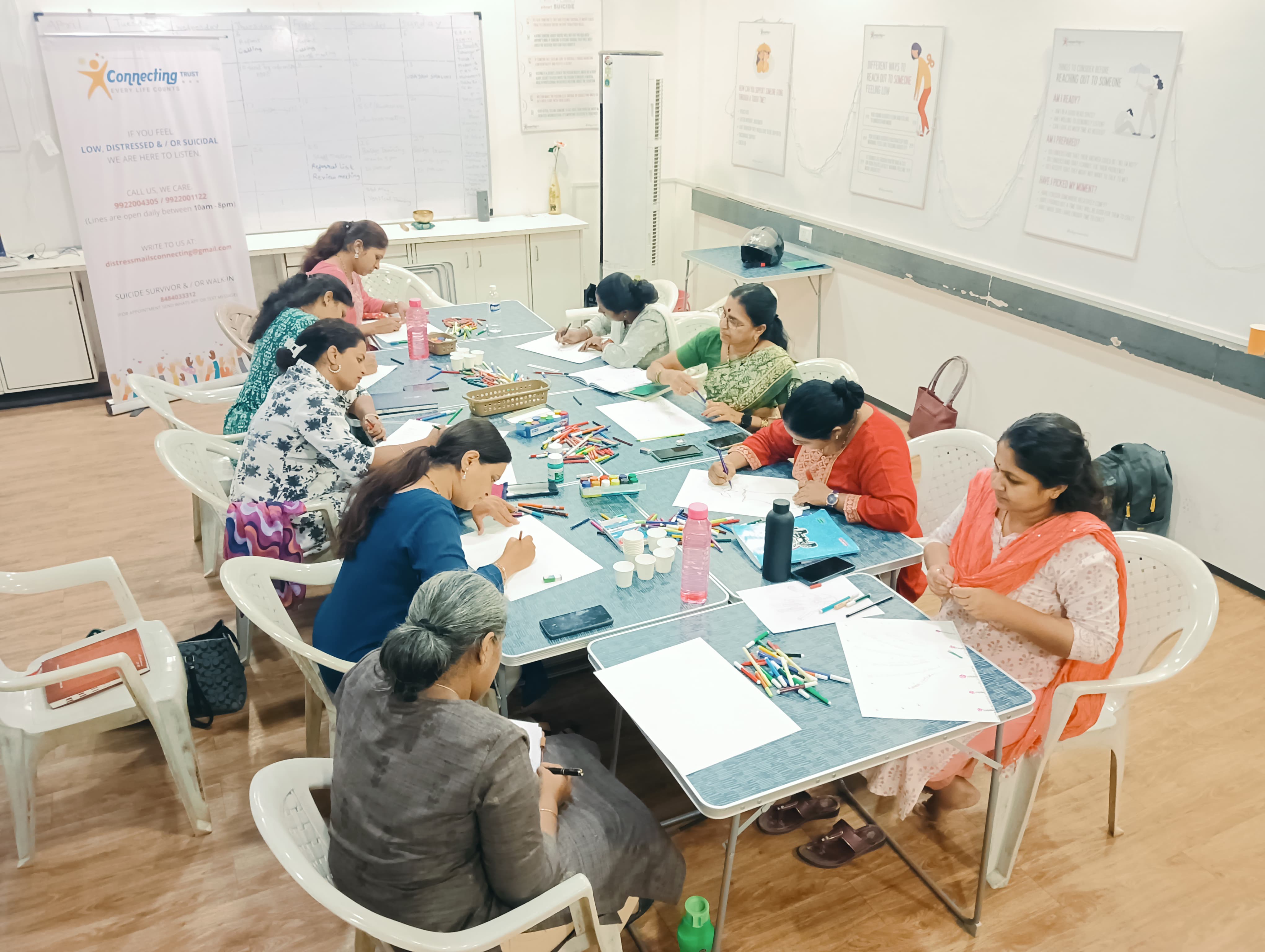 People expressing themselves through a guided creative activity