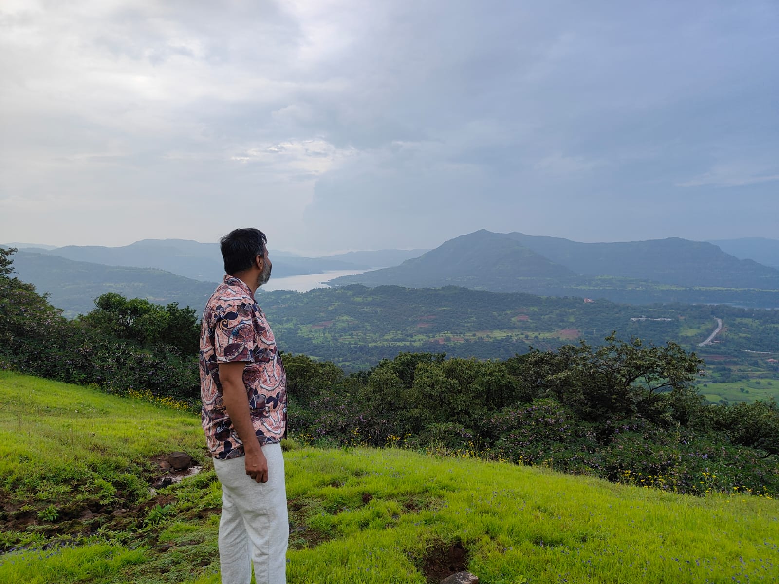 Santosh looking across a wide landscape